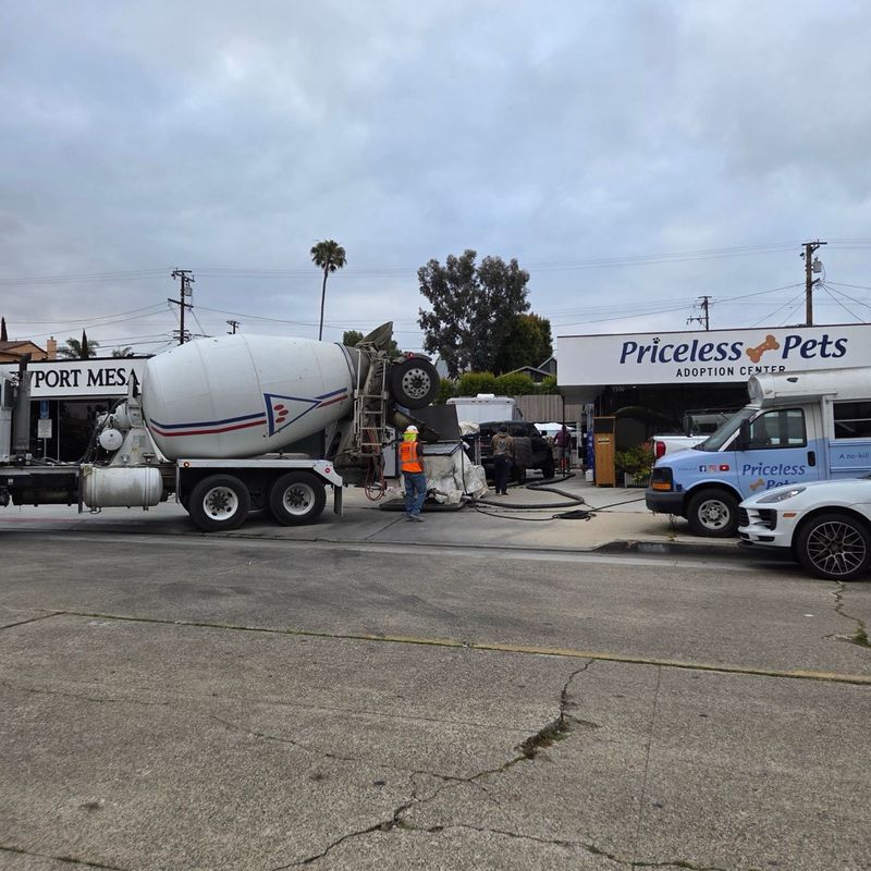 A cement truck delivers concrete during the kennel rebuild