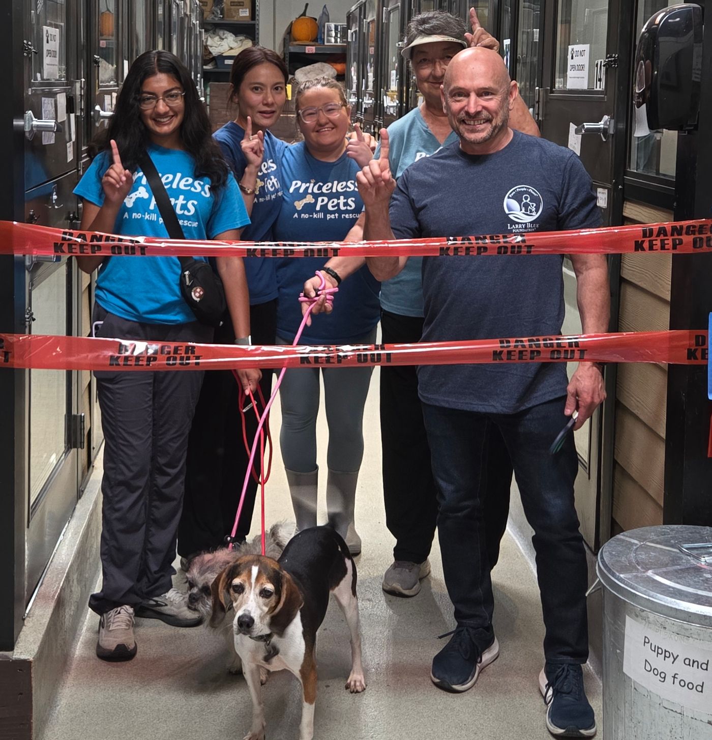 Larry Blue Foundation and Priceless Pets volunteers celebrate seven rebuilt kennels